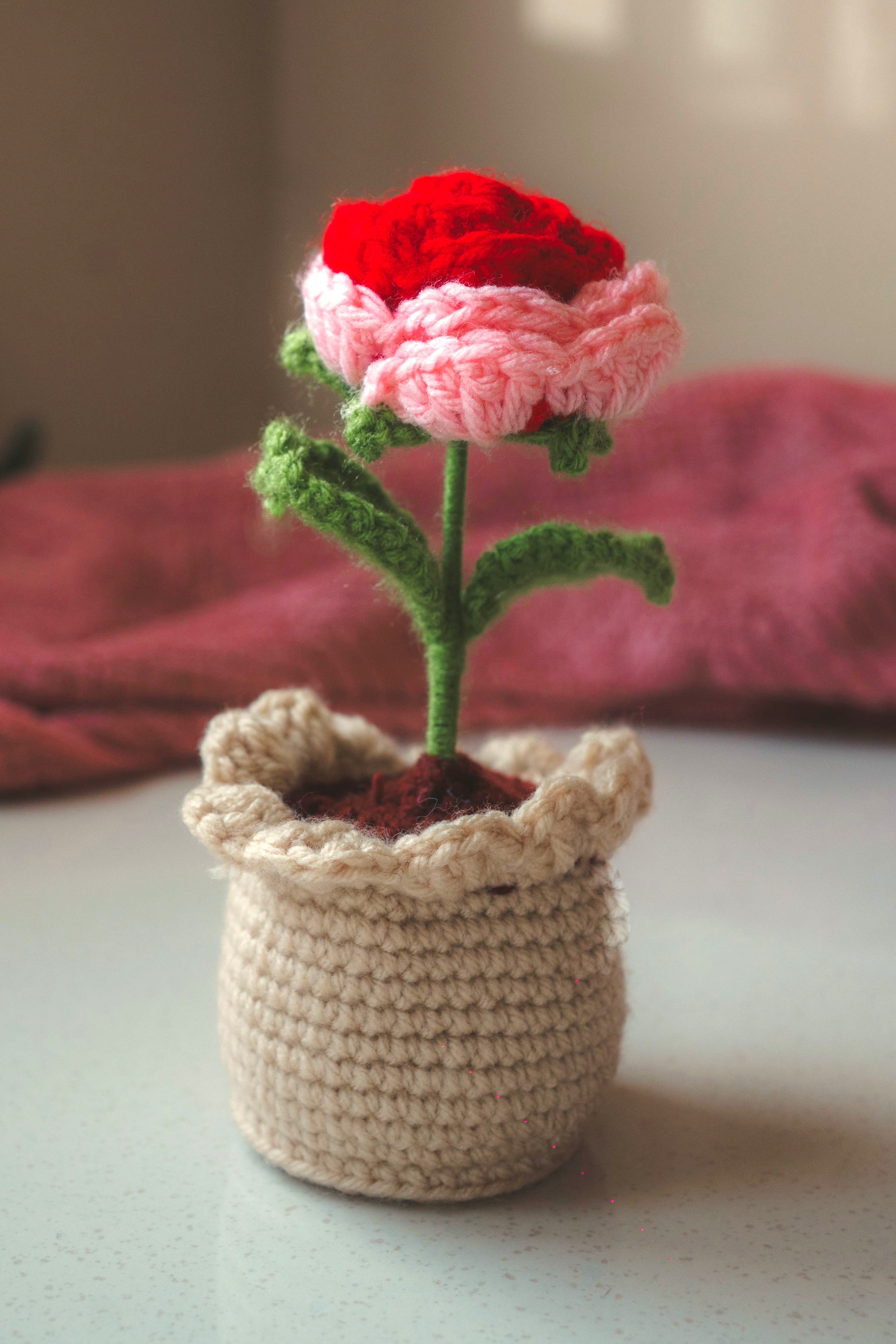 colourful crochet rose flower in baby pink and red colour with flower pot 